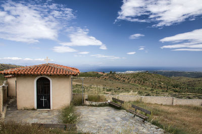 House by sea against sky