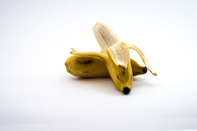 Close-up of bananas on white background