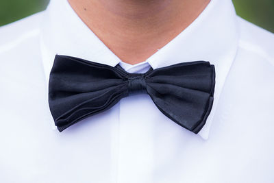 Close-up of man wearing bow tie