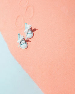 Creative minimal beach concept. summer vacation layout with sand on blue background. flat lay.