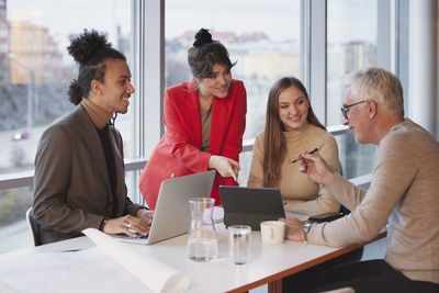 People having meeting in office