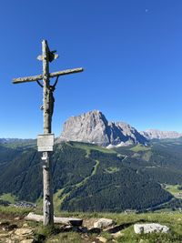 Cross against clear blue sky