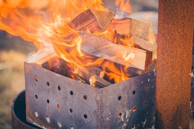 Close-up of fire burning on wood