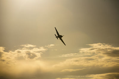 Low angle view of airplane flying in sky