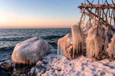 Panoramic shot of sea against sky during sunset