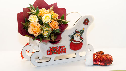 Close-up of rose bouquet on white table