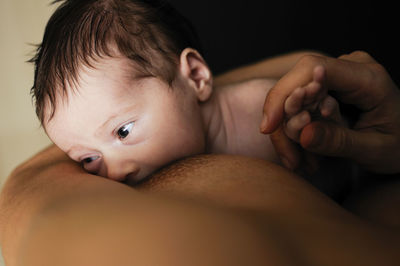 Midsection of sensuous mother breastfeeding baby girl