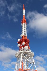 Low angle view of communications tower against sky