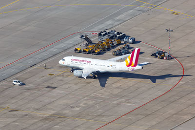 High angle view of airplane on airport runway