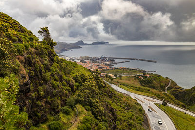 High angle view of road by sea against sky