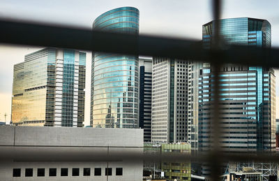 Low angle view of office building against sky