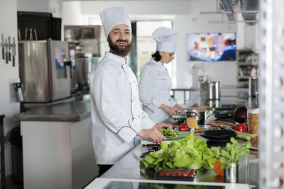 Portrait of young man standing in laboratory