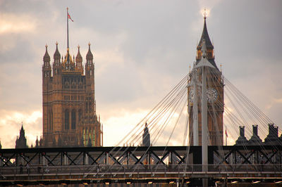 View of steel cables by bridge with big ben and parliament house in background