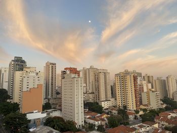 High angle view of buildings against sky during sunset