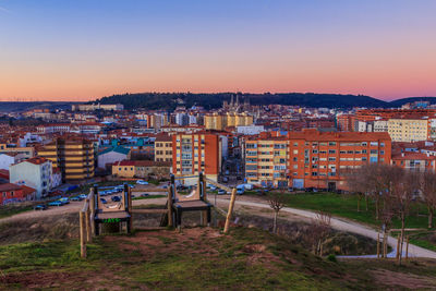 High angle shot of townscape against sky at sunset