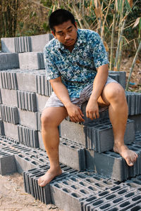 Portrait of boy sitting on steps