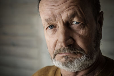 Close-up portrait of sad elderly man