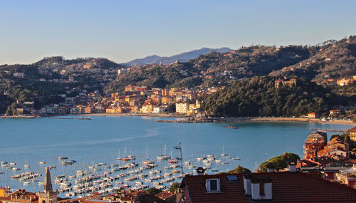 High angle view of townscape by sea