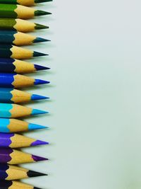 High angle view of multi colored pencils on white table
