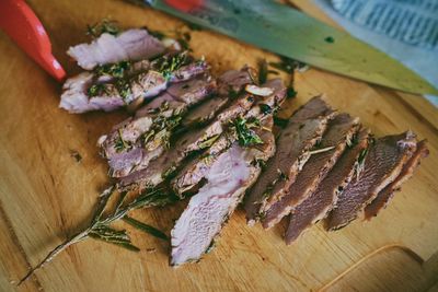 High angle view of meat on cutting board