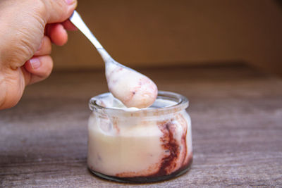 Close-up of hand holding ice cream