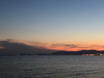 Scenic view of sea against sky at sunset