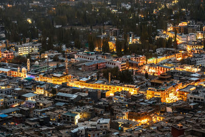 High angle view of illuminated buildings in city