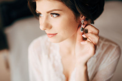 Portrait of young woman looking away