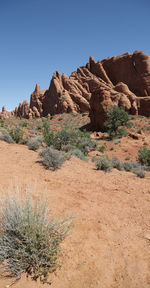 Rock formations in desert against clear sky