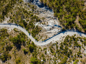 Sneaky road in desert landscape shots with drone 