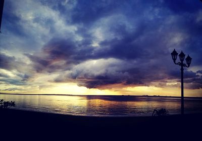 Scenic view of sea against dramatic sky