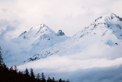 Foggy winter mountain landscape. panoramic view of mountains near brianson, serre chevalier resort