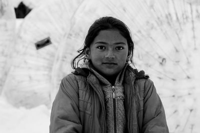 Portrait of teenage girl standing in snow