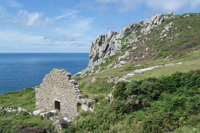 Scenic view of sea and buildings against sky