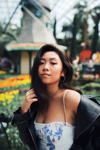 Portrait of a beautiful young woman standing outdoors