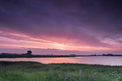 Scenic view of lake against sky during sunset