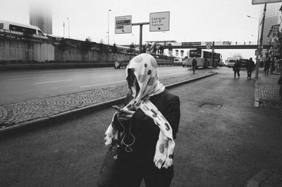 Woman standing in city