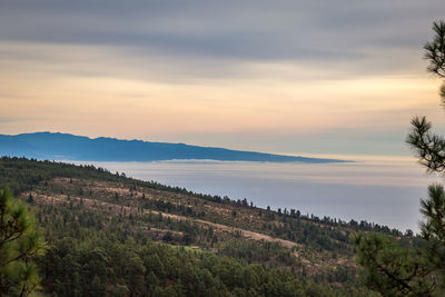 Scenic view of landscape against sky during sunset