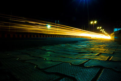 Light trails on street in city at night