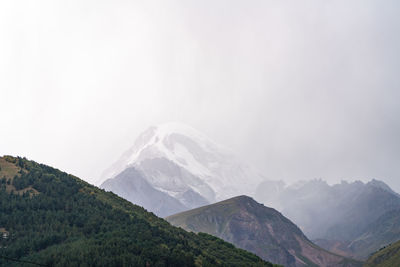 Scenic view of mountains against sky during winter