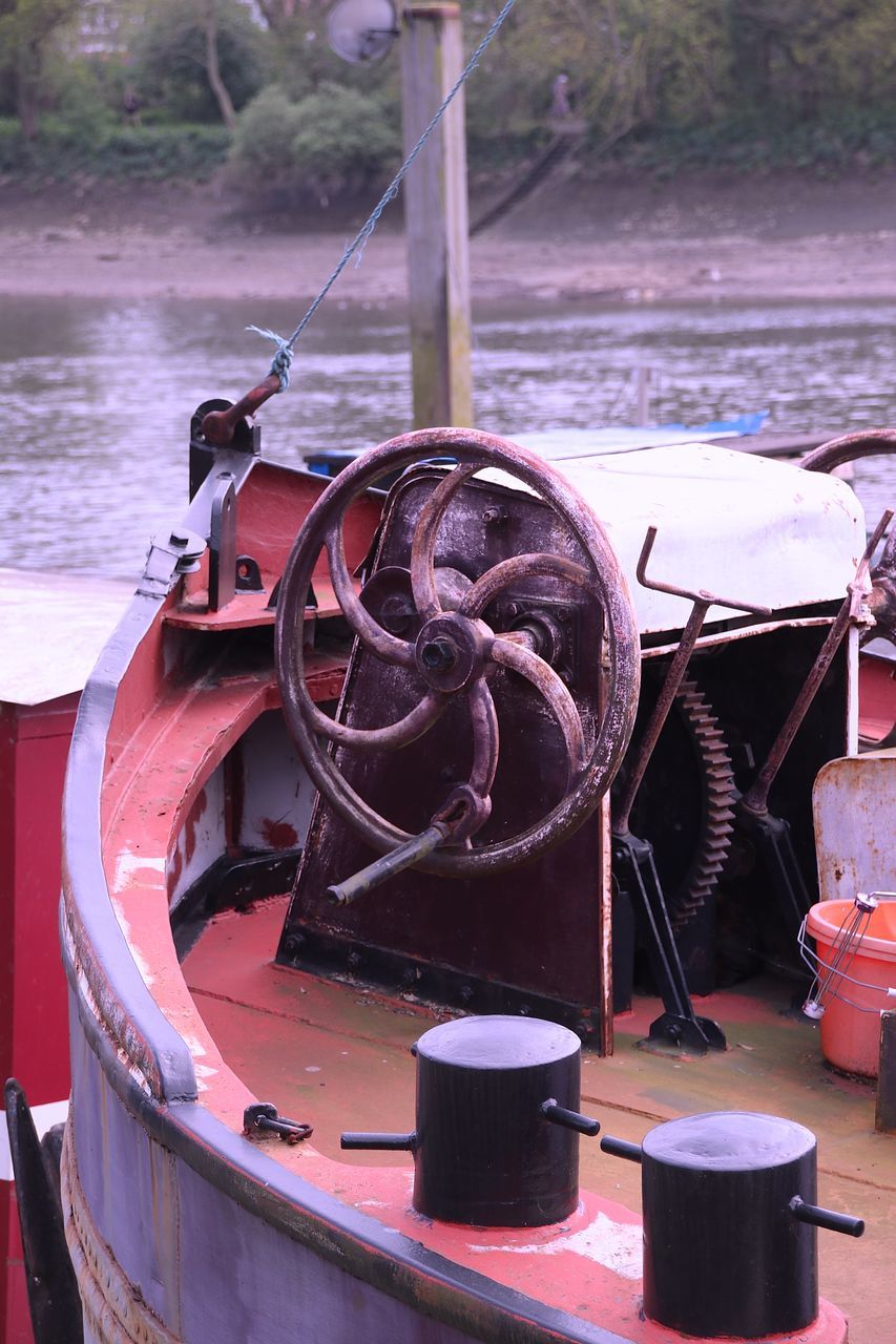CLOSE-UP OF MACHINERY ON BOAT