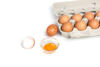 Close-up of eggs against white background