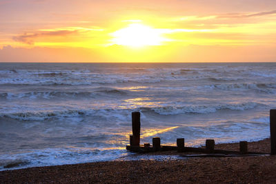 Scenic view of sea against sky during sunset