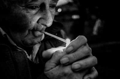 Portrait of man smoking cigarette