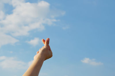 Low angle view of person against sky