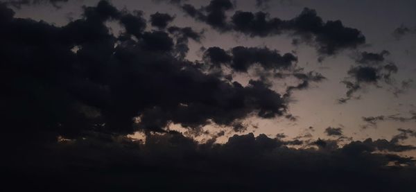 Low angle view of dramatic sky during sunset