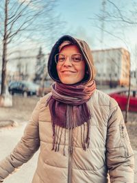 Portrait of a smiling young woman in winter