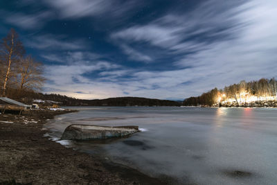 Landscape of half frozen vlasina lake in cold winter night. long exposure photo.