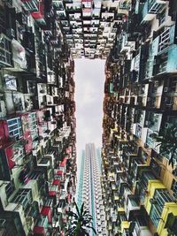 Directly below shot of buildings against sky