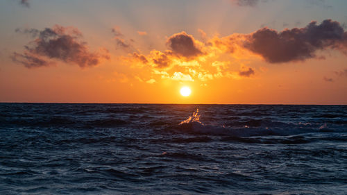 Scenic view of sea against sky during sunset